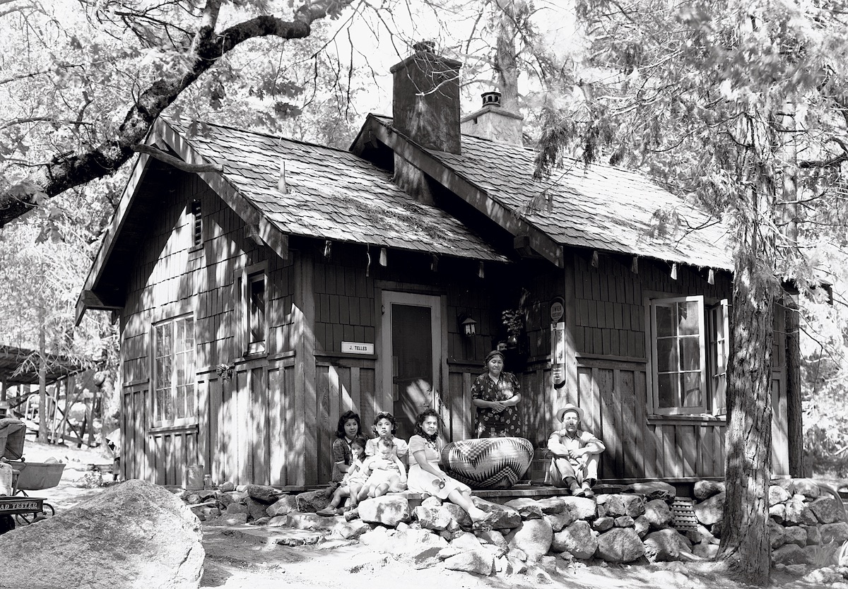 June 1941, Lucy Telles (back row) pictured with family and her famous forty-inch diameter basket. In Scrape the Willow Until It Sings, Deborah Valoma writes that Telles's bas- ket was frequently...publicized in Yosemite Park promotional material. Today, the basket can be seen at the Yosemite Museum. [Photo] Ralph H. Anderson, Yosemite Historic Photo Collection