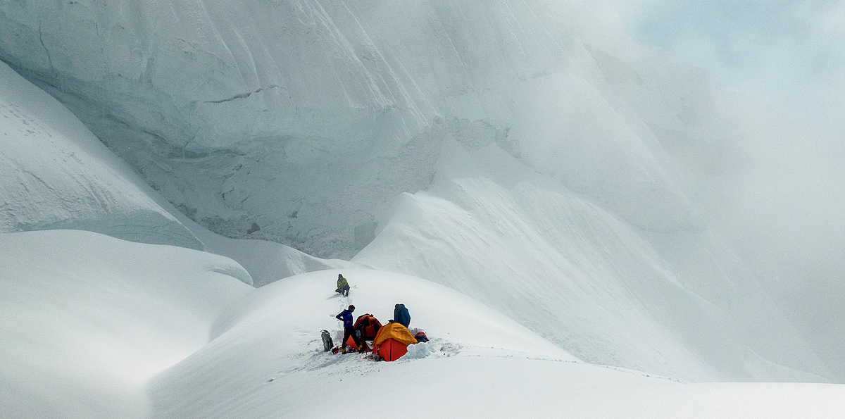 The team prepares for a 36-hour storm at Camp III on Link Sar. [Photo] Graham Zimmerman