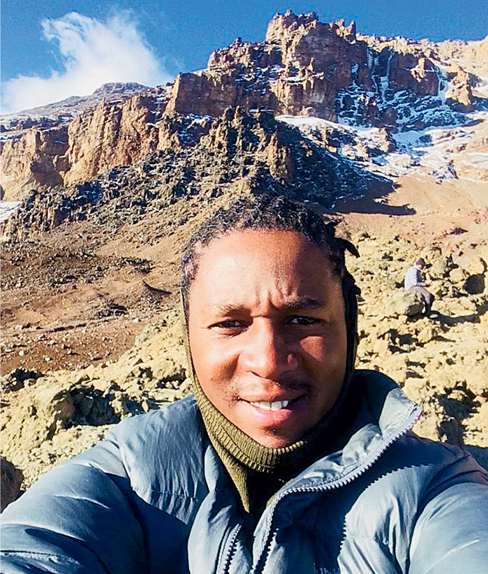 Lukiano Lucky Barnabas at Arrow Glacier Camp (15,981'). [Photo] Lukiano Barnabas