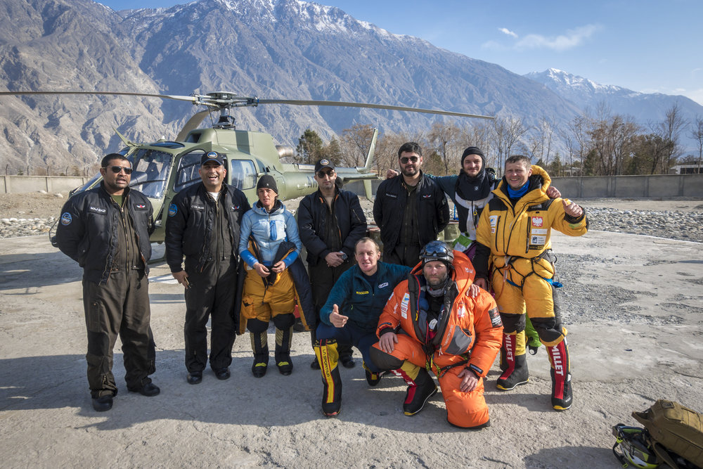 Dennis Urubko, Adam Bielecki, Jaroslaw Botor and Piotrek Tomala with Elizabeth Revol and the Askari Aviation pilots after the rescue on Nanga Parbat. [Photo] Piotrek Tomala, courtesy of the American Alpine Club