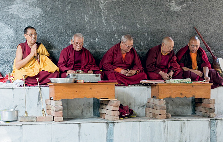 Buddhist monks during Smith's cremation ceremony. [Photo] Chris Gibisch