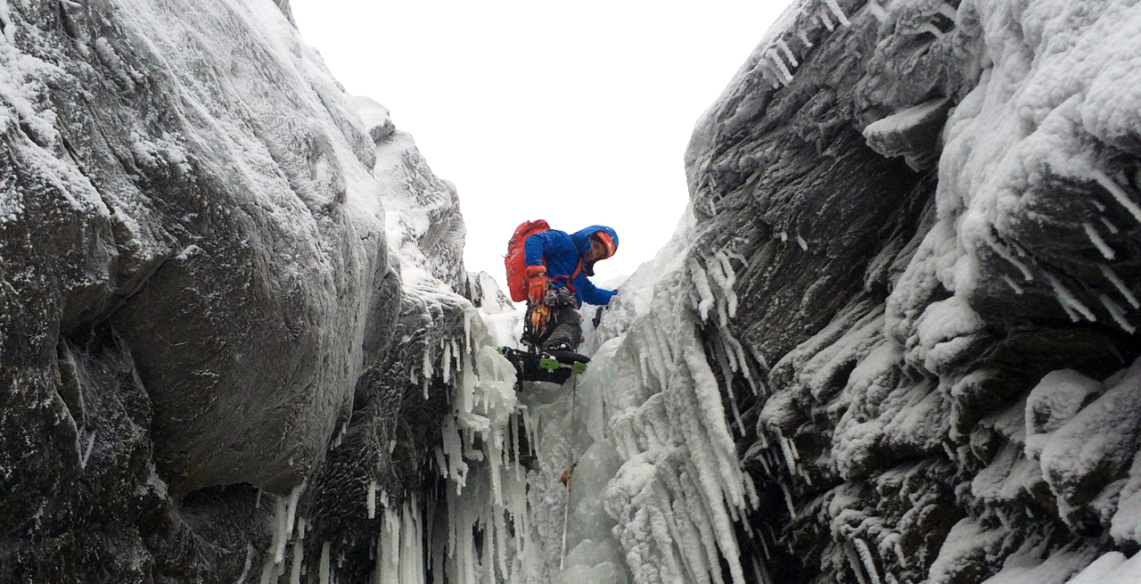 The author climbing Hidden Gully (WI3-4, 650'), Smugglers' Notch, VT in early-season. [Photo] Sam Fox Knapp