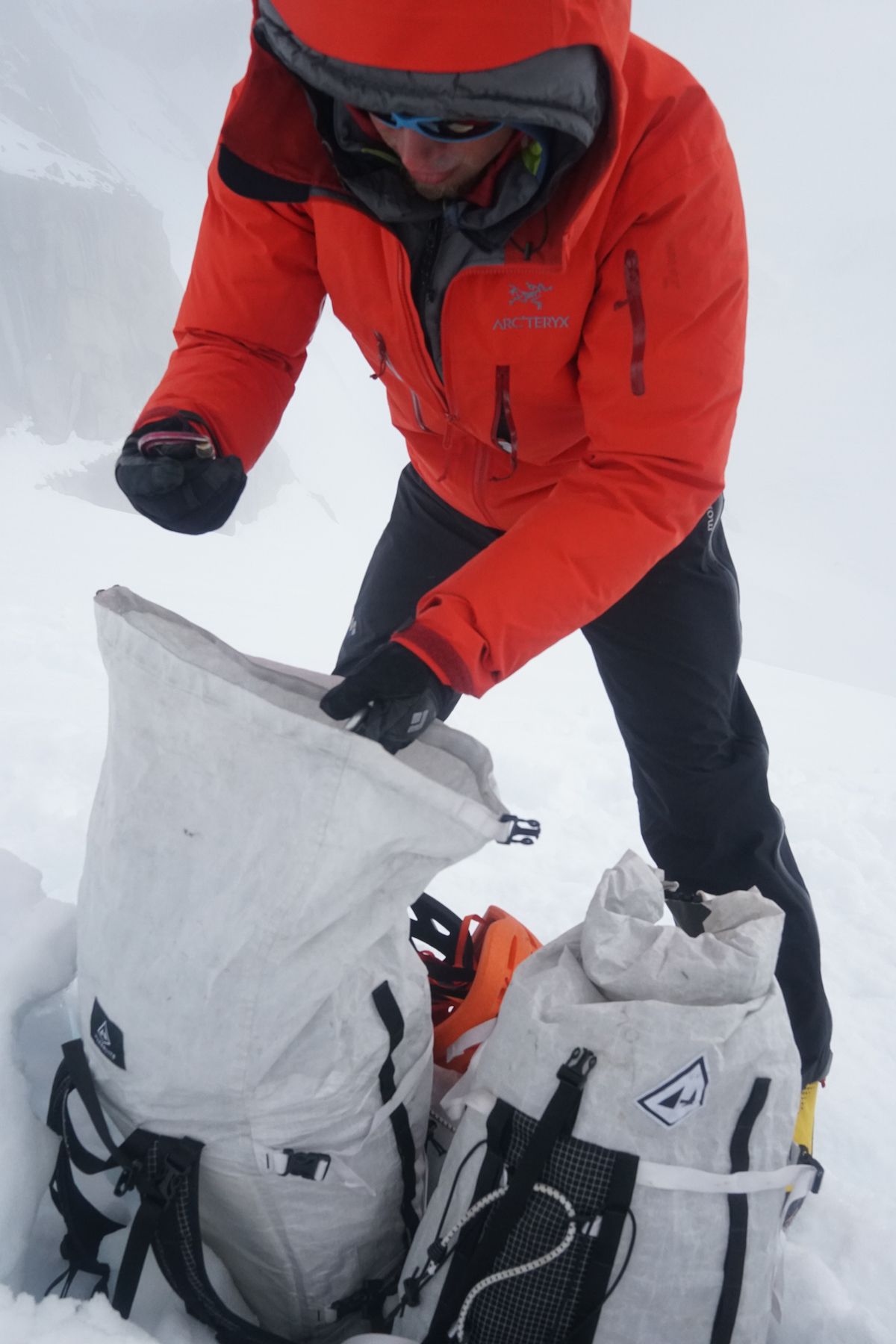 This jacket is roomy enough to fit over a down parka. Thayer at a snowy belay in the Neacola Mountains, Aleutian Range, Alaska. [Photo David Fay]