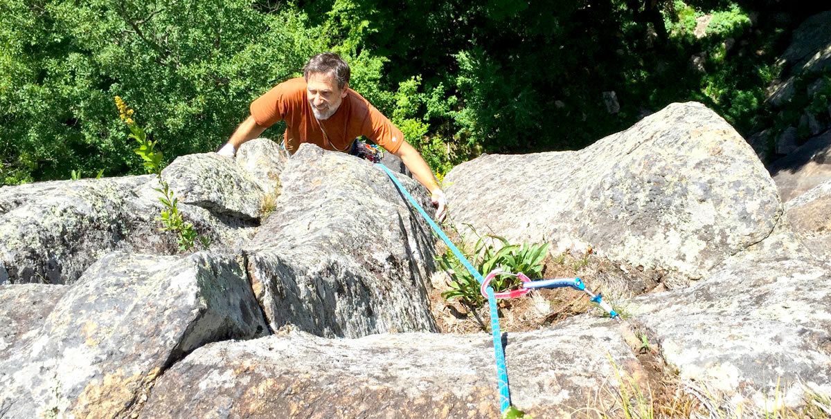 Bill Dodd following P1 on Sunburst Arete, ADK (5.8, 200'). Shown here is a No. 1 Ultralight Master Cam placed in a vertical crack between dirt clumps. [Photo] Chris Van Leuven