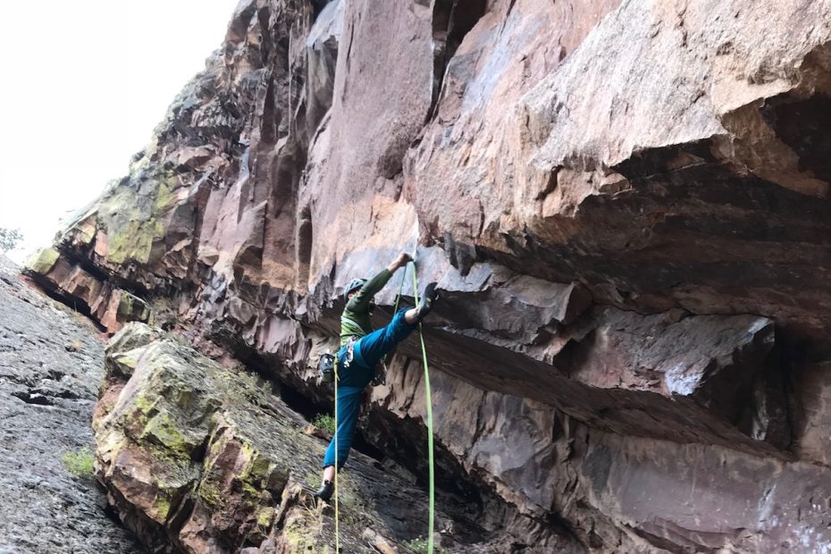 Corey Flynn starts the first pitch of Scary Canary (5.12b/c R), Eldorado Canyon, Colorado. [Photo] Chris Van Leuven