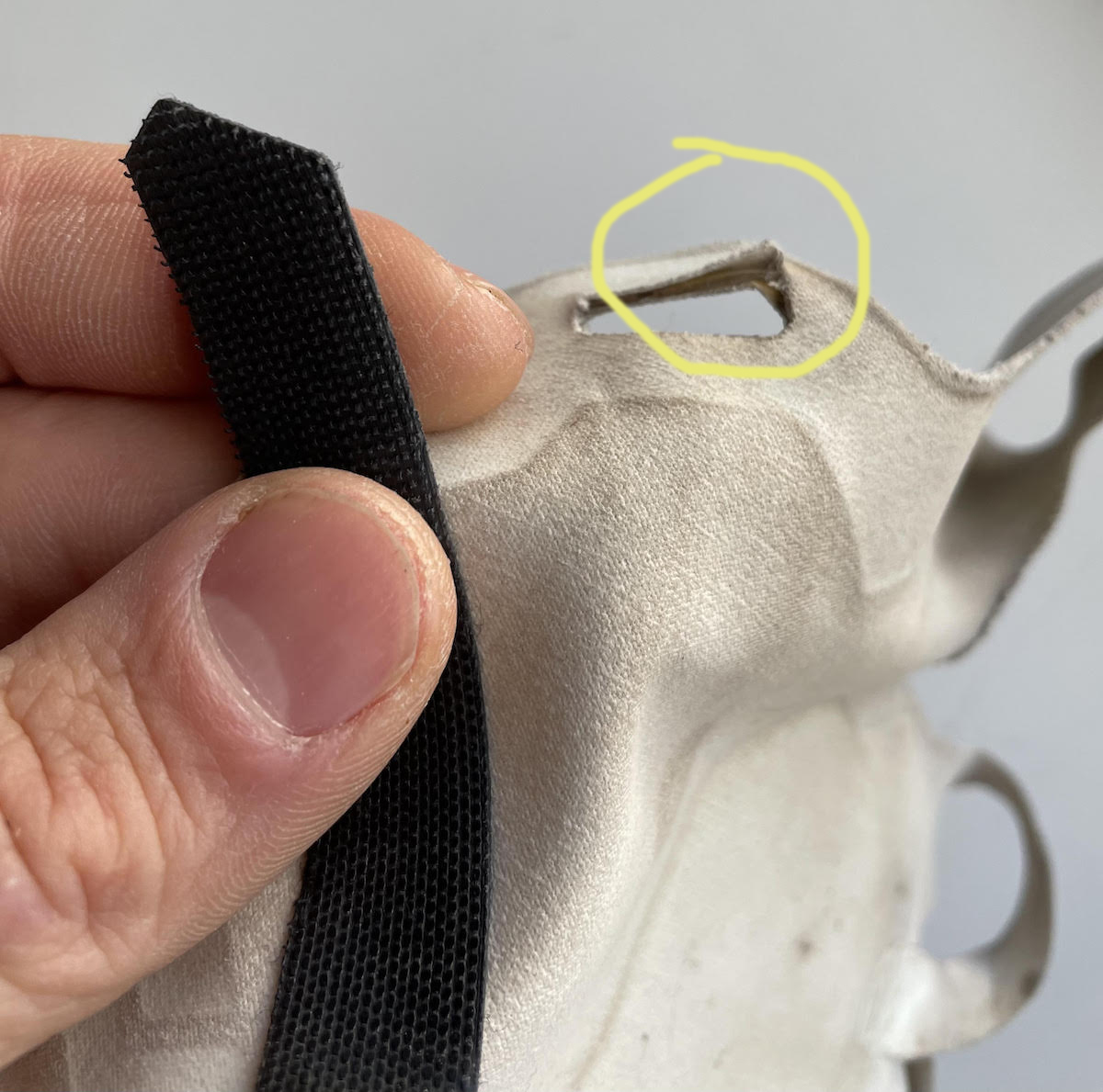 A John Madden-style highlight shows where the slot that secures the Velcro wrist strap is beginning to tear. [Photo] Derek Franz