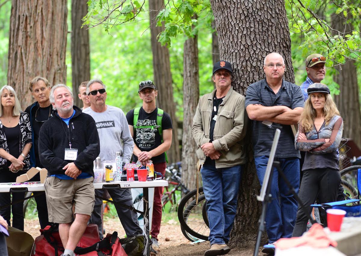 Lynn Hill (far right) stands next to Mike Graham and Ron Kauk (both leaning against the tree), and Dave Diegelman is second from the left, among other unidentified attendees. [Photo] Ed Hartouni