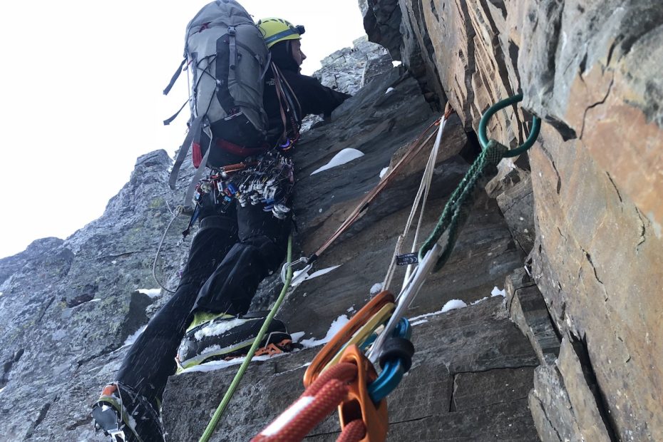 Jess Roskelley leads through loose blocks on Day 2 during the first ascent of Canmore Wedding Party (AI5 M7, 2,625') on A Peak in Montana's Cabinet Mountains. [Photo] Scott Coldiron