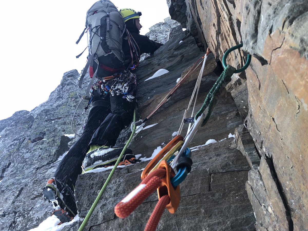 Jess Roskelley leads through loose blocks on Day 2 during the first ascent of Canmore Wedding Party (AI5 M7, 2,625') on A Peak in Montana's Cabinet Mountains. [Photo] Scott Coldiron