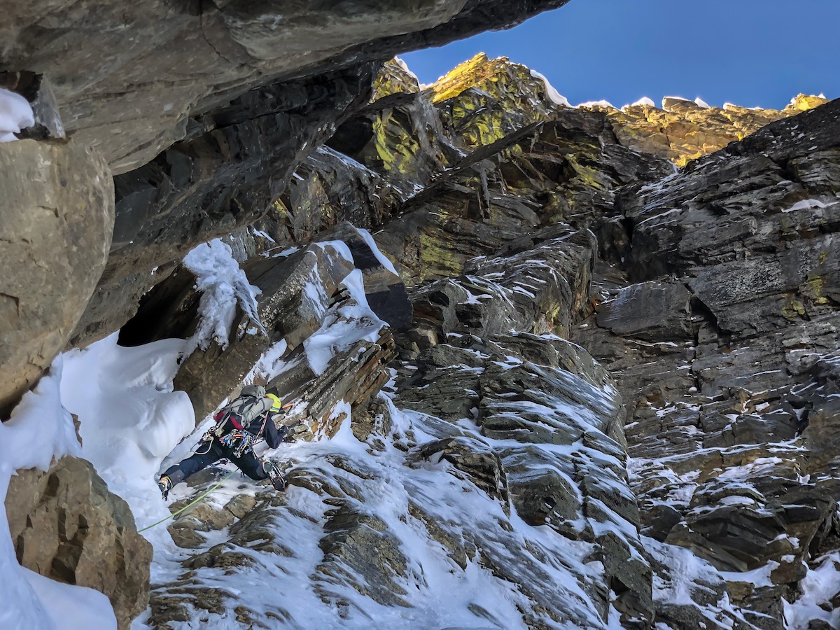 Roskelley leads M5 terrain off the bivy ledge. [Photo] Scott Coldiron
