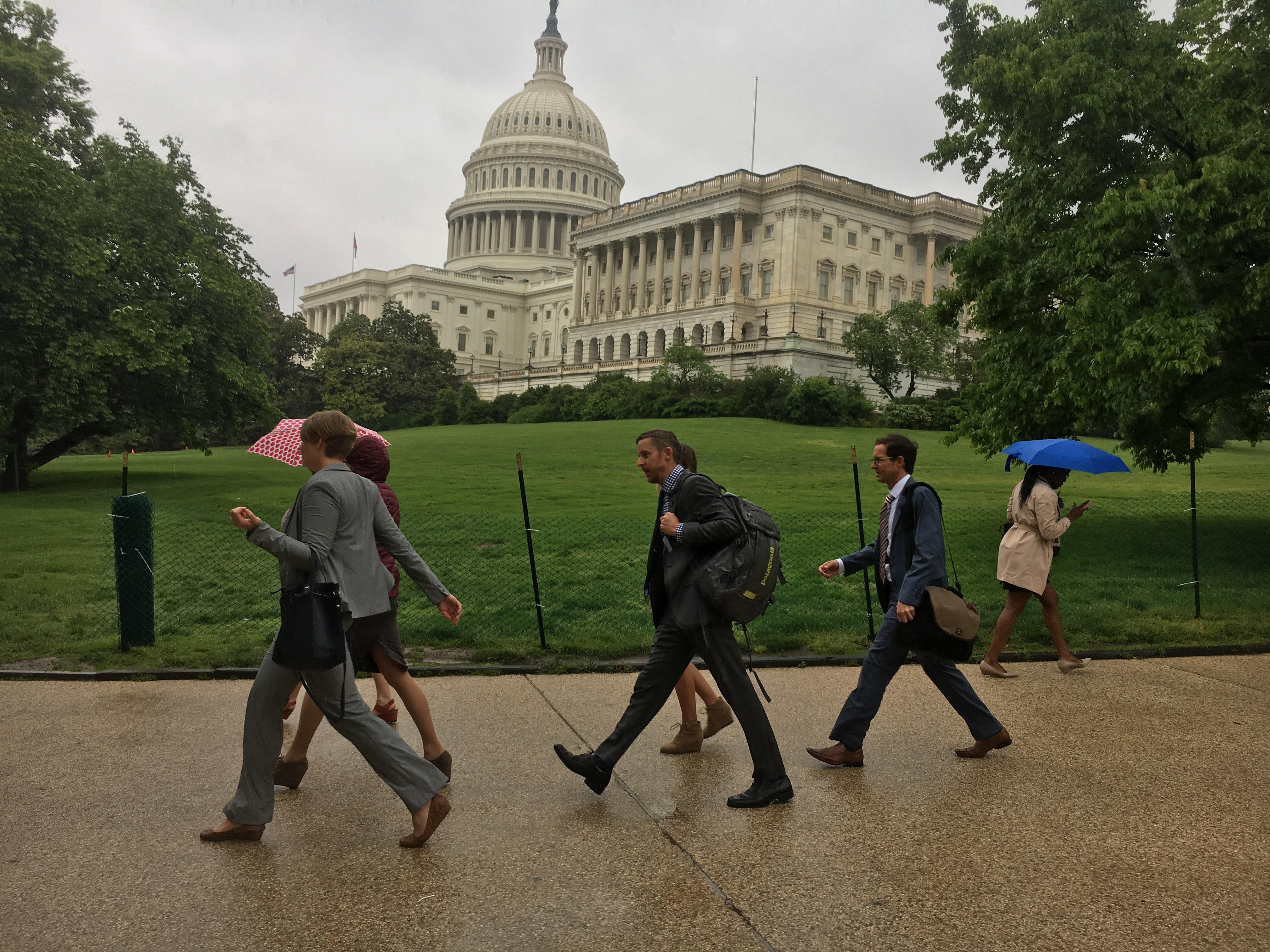 The delegation of Colorado climbers walks through the rain from the House to the Senate while lobbying Congress in Washington, DC, on May 11 as part of the Climb the Hill event organized by the Access Fund and American Alpine Club. [Photo] Derek Franz