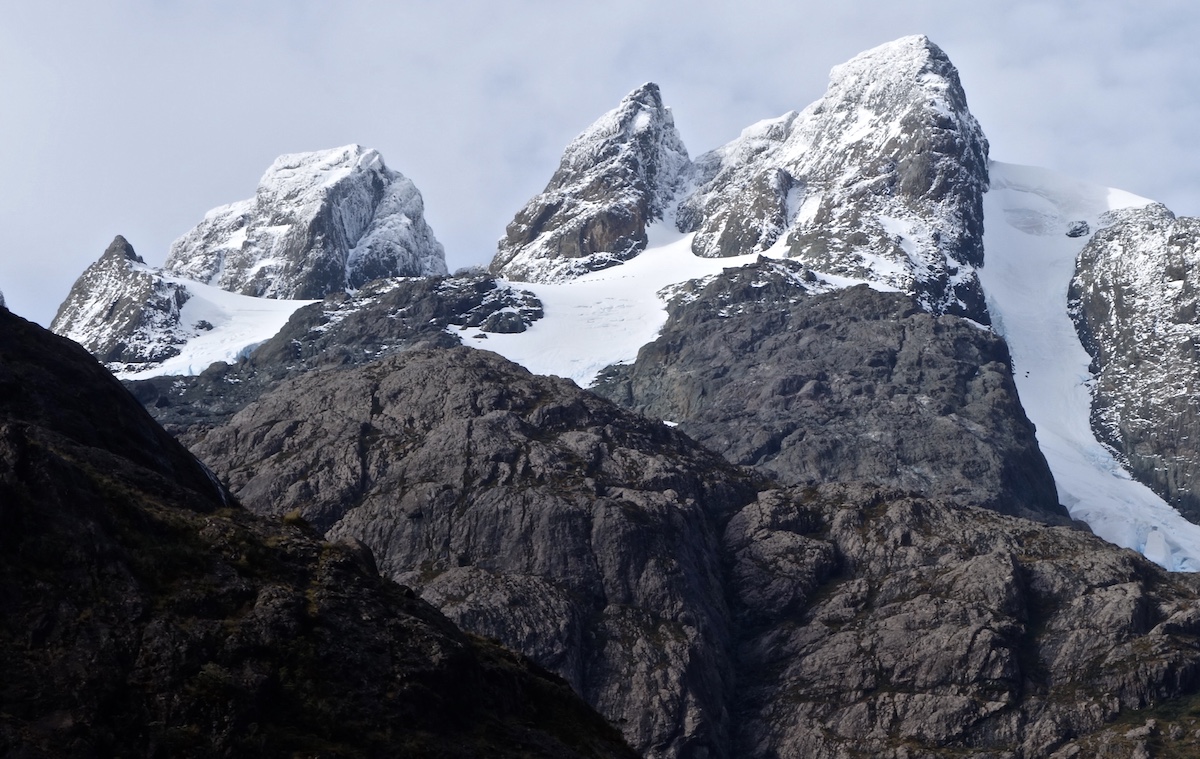 Looking toward the peaks nearest Whitney Clark, Jon Griffin and Tad McCrea's camp with their approach ridge in the foreground. Their route, Estoy Verde (M6 200m) climbs the obvious corner system on leftmost peak. [Photo] Whitney Clark