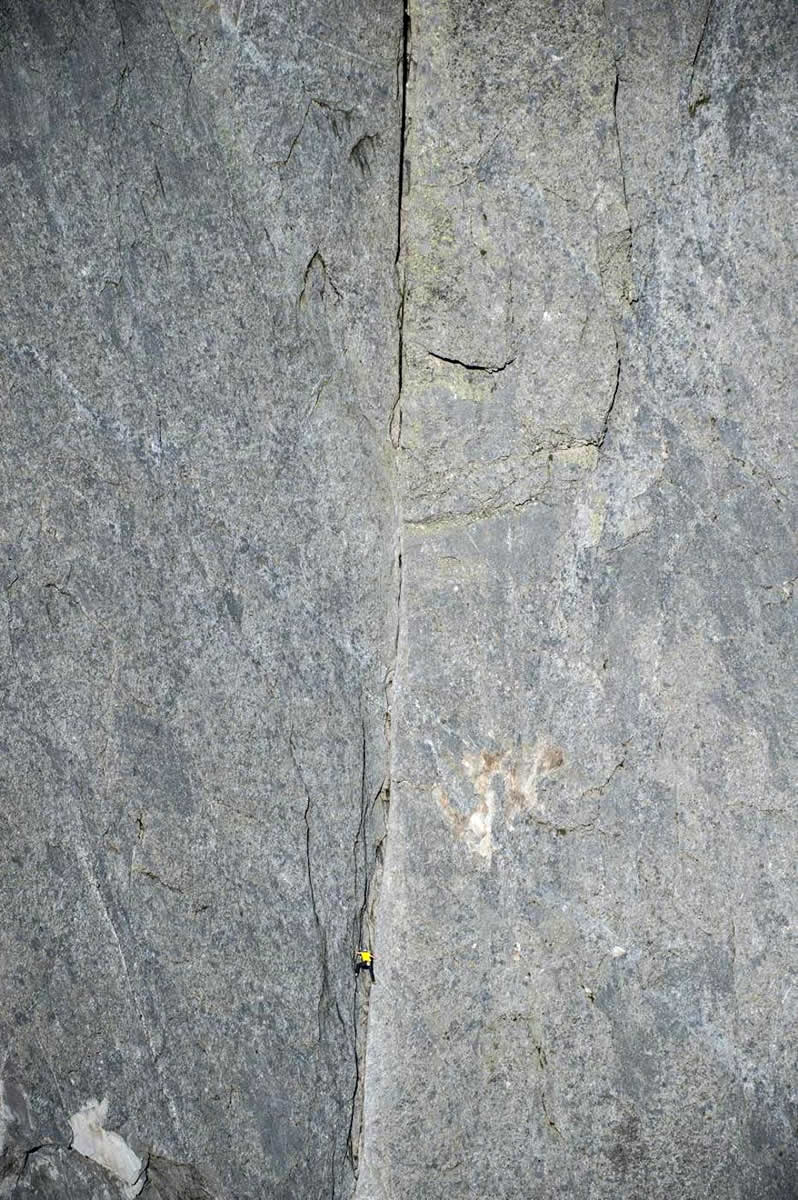 Arnold free solos the Via Cassin (6a or 5.10a 800m) on Switzerland's Piz Badile (3308m). [Photo] Dani Arnold collection
