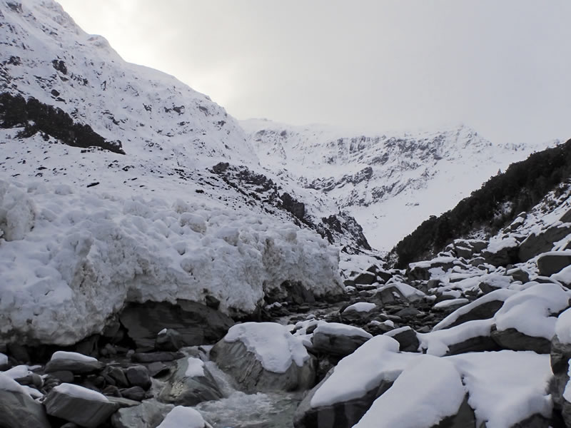 The approach up Rainbow Stream, with the fresh avalanche debris from the upper slopes of Moncrieff Peak that had partially blocked the stream. [Photo] Ben Dare