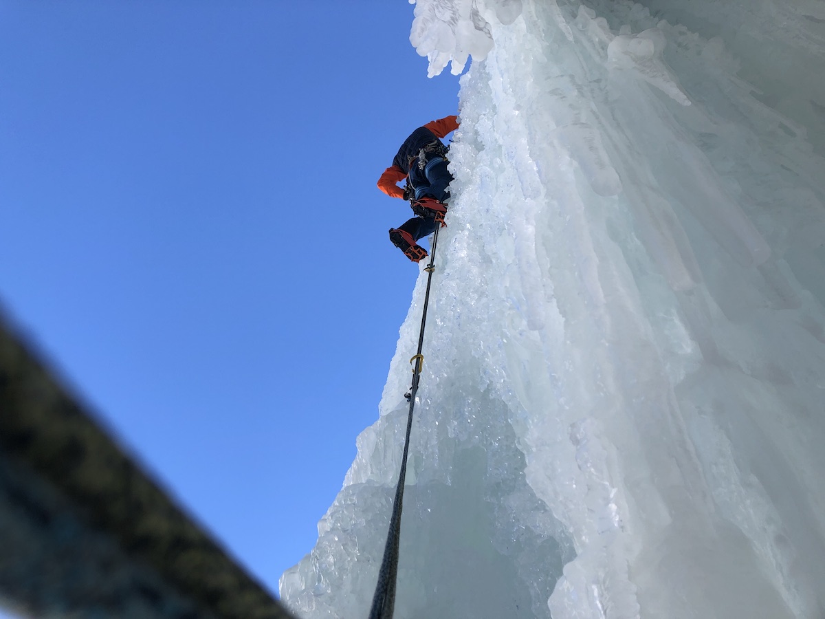 Mikey Arnold leading the WI5+ curtain pitch on the Cascade de Bonatchiesse. [Photo] Rob Coppolillo