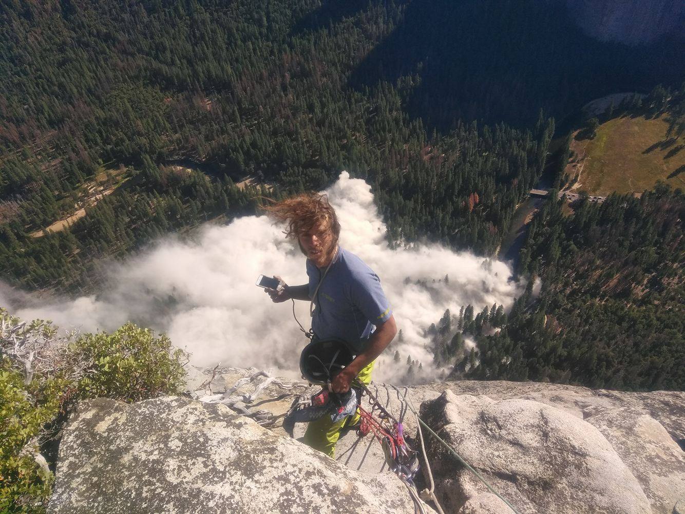 Peter Pass the Pitons Pete Zabrok took this photo of his partner Ryan Sheridan on top of Yosemite's El Capitan when the September 28 rockfall broke loose and sent debris flying all the way into the Merced River, which can be seen below. A man was injured when a rock crashed through the roof of his SUV. Zabrok, Sheridan and Patrick Mcredmond were climbing in the area of the wall where the rockfalls originated, and were just a few hundred feet above the first rockfall when it happened. [Photo] Peter Zabrok