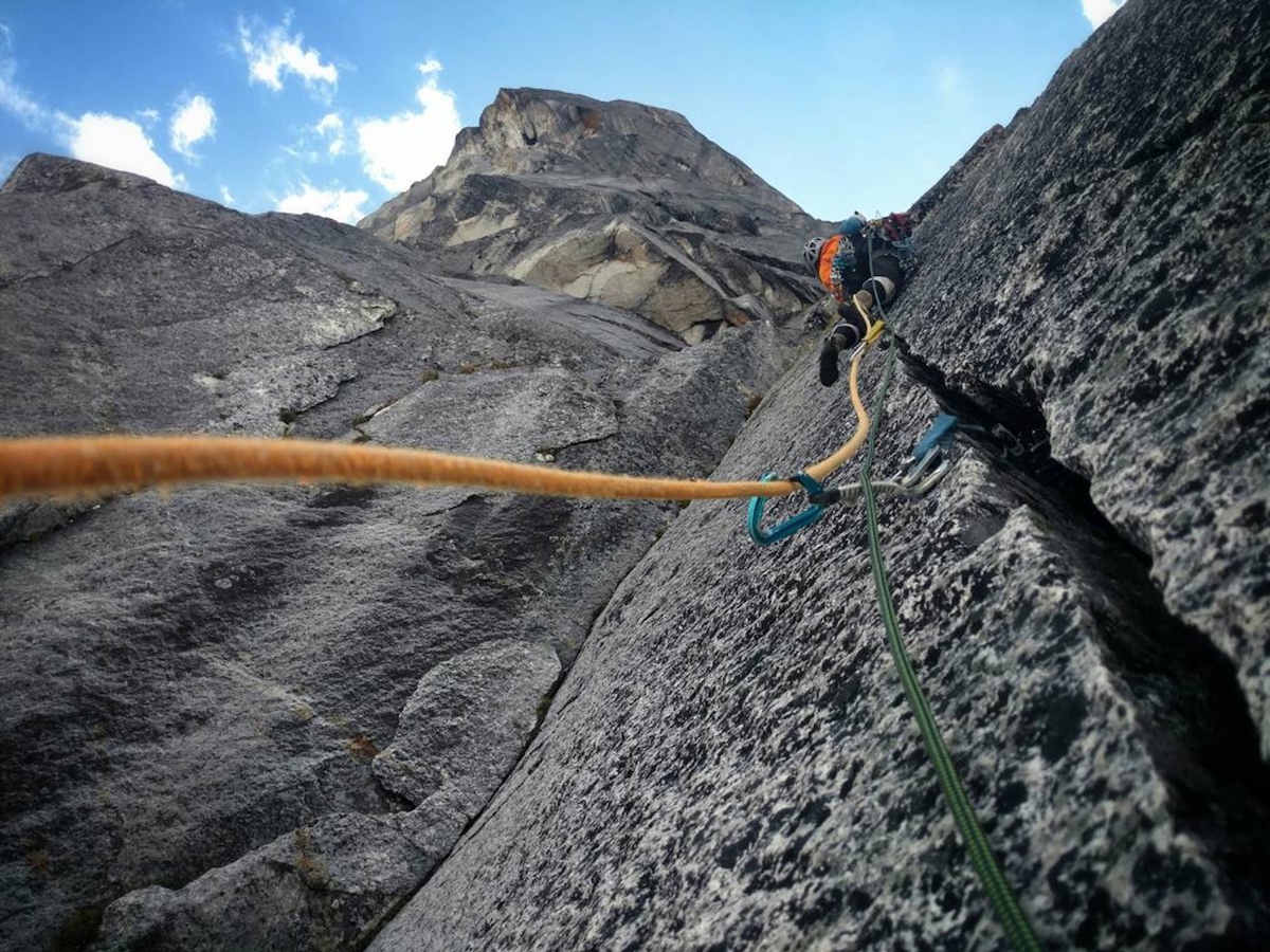 Woodward leads beautiful some cracks that led to rather runout slab climbing on the first ascent of Drinking Pink Rabbits (5.11 A2, 1,400'), which he did with Zimmerman. The name comes from one of their favorite tracks by the band The National. [Photo] Graham Zimmerman