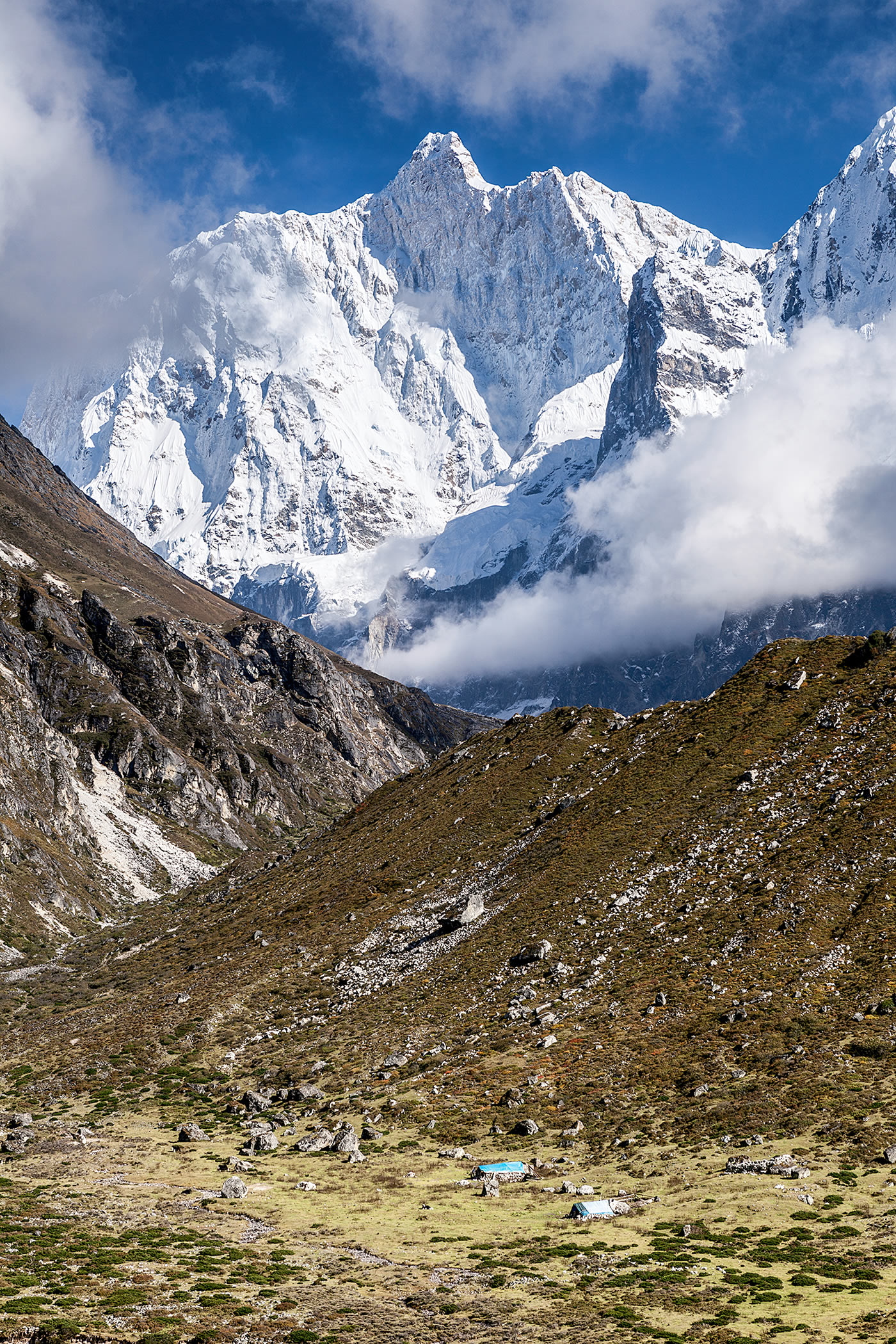 The north face of Kumbhakarna, above local settlements. Some names of local expedition workers are absent from written records. For a few in this article--Penuri, Ungati and Tumba--where we couldn't find other sources, we relied on climbers' memories, and it's possible the real names might be different. [Photo] Javier Camacho Gimeno