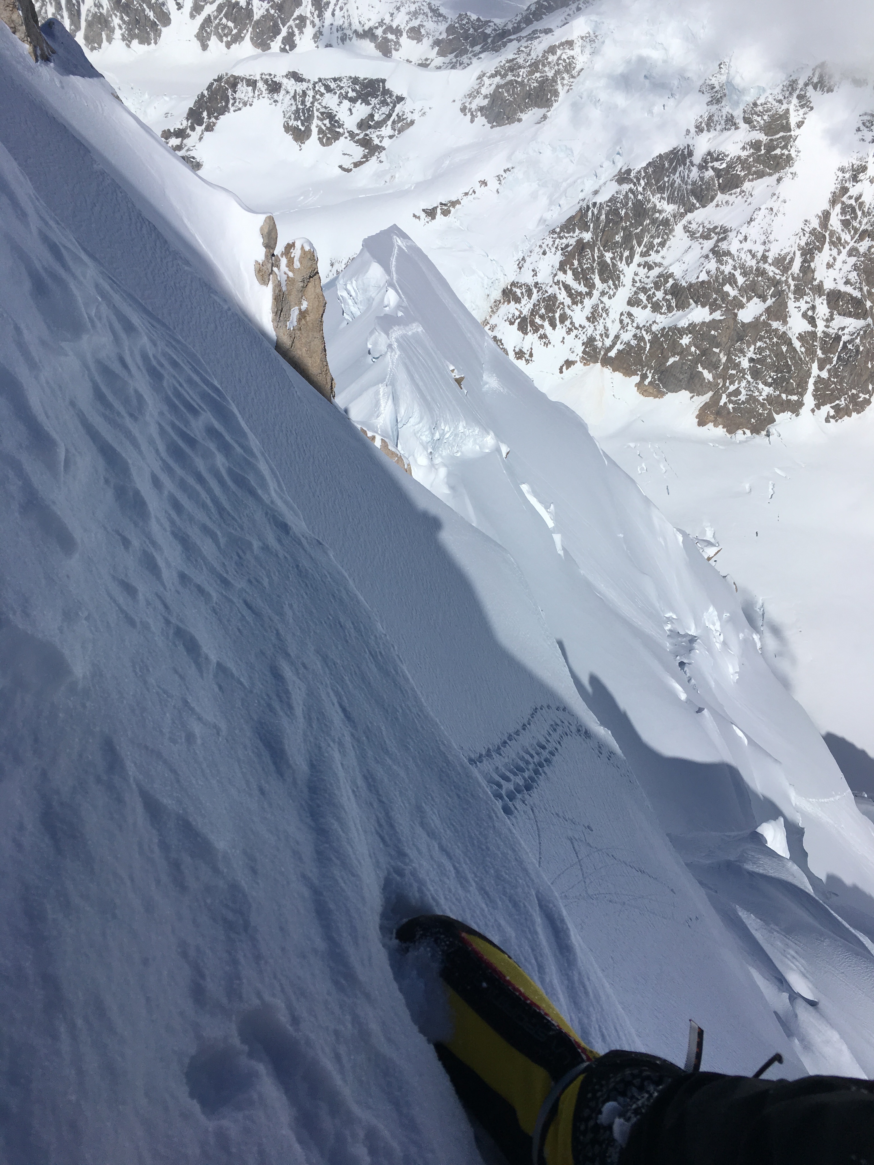 Looking down while descending Begguya's upper Northeast Ridge. [Photo] Colin Haley