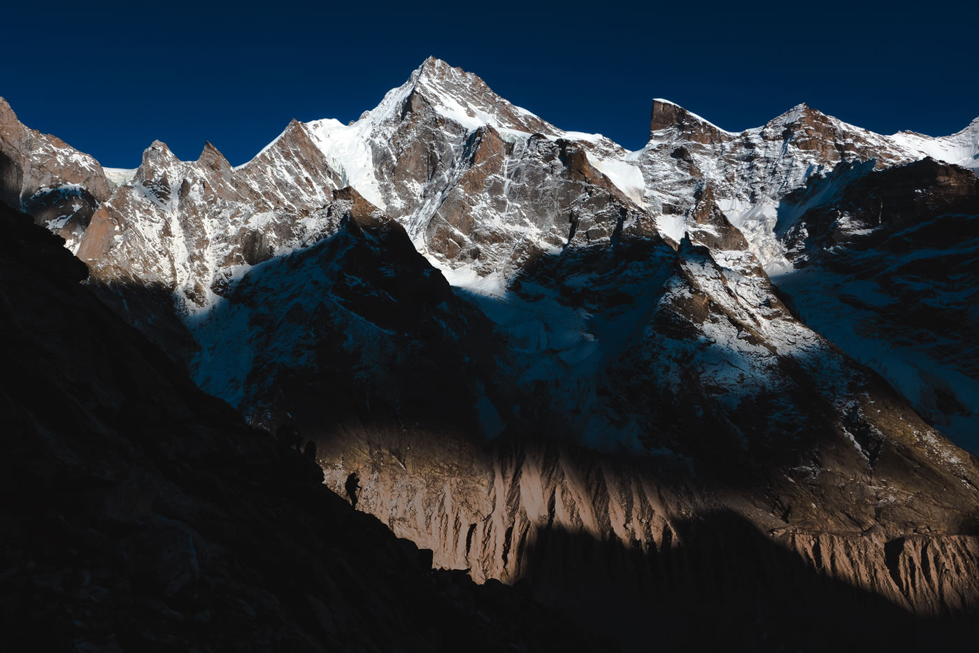 Hayden Kennedy, Marko Prezelj and Manu Pellissier descend into shadows after the first ascent of Light Before Wisdom. [Photo] Urban Novak