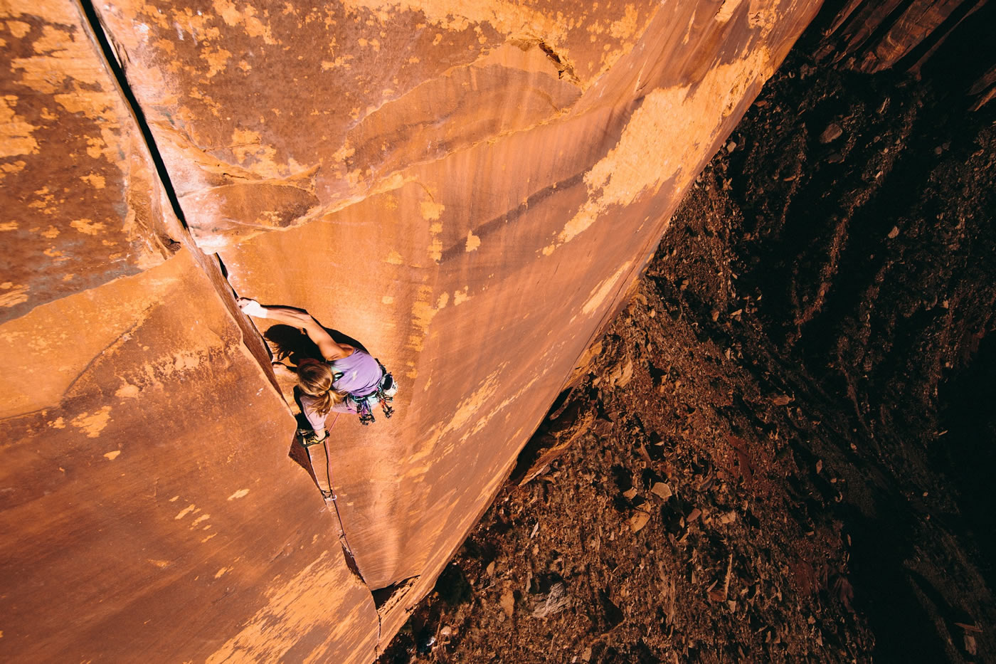 I struggled up Polygrip (5.11+), straining hard on finger locks and frantically charging from one cam placement to the next, the pump clock ticking and no good rests in sight. After falling at the roof, I hung from the rope, heart pounding and mind spinning. Once on the ground, I watched Yosemite crusher and Indian Creek regular Miranda Oakley float up the same crack, her breath slow and her movement effortless and calm, a perfect dance of human and rock spinning before us. Breathe, move calmly, and with confidence: yet another lesson this sandy stone has to teach. [Photo] Forest Woodward