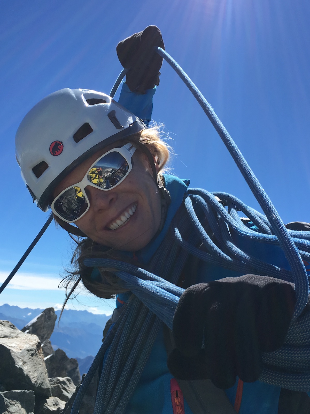 Erin Smart on the summit of la Meije in 2016, with the Pic Central in the background. [Photo] Kurt Dienel