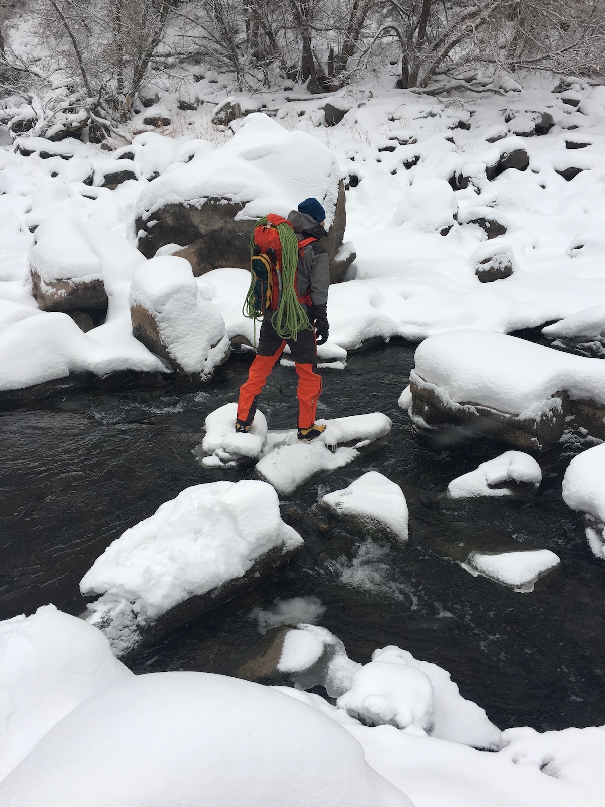 The author searches for a crossing on the Colorado River with a fully loaded Tupilak pack on New Years Eve, 2018. [Photo] Craig Helm