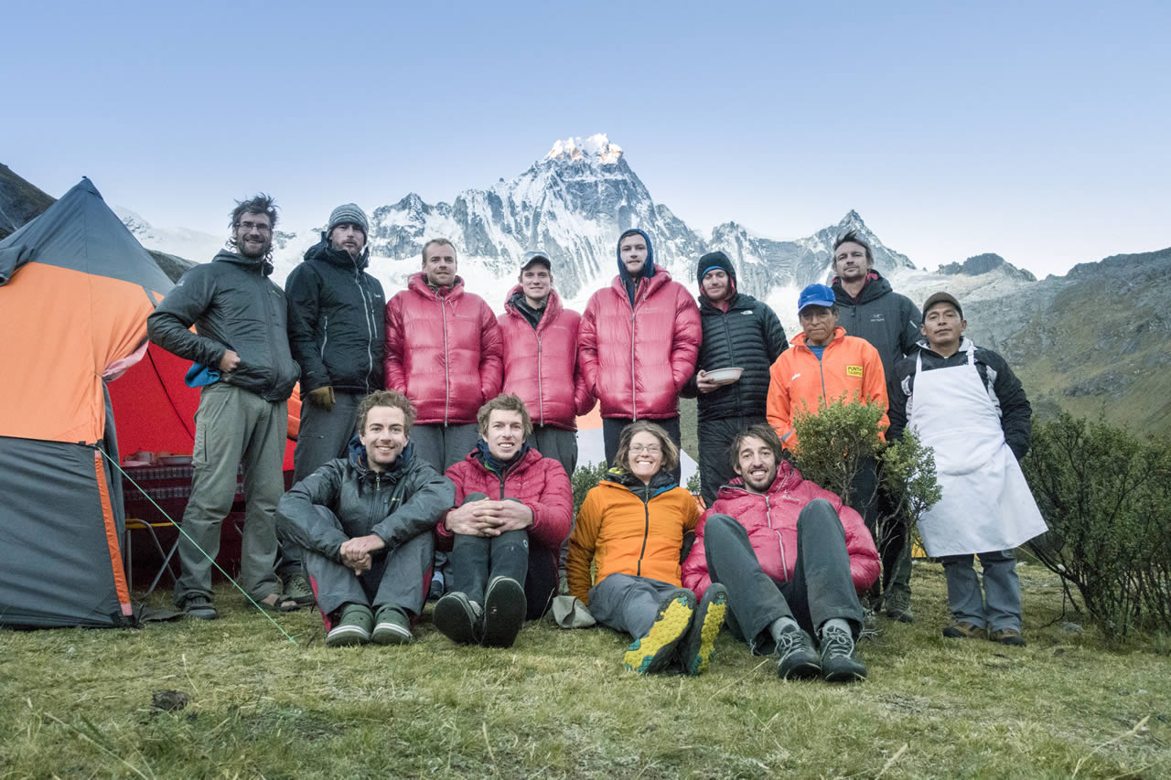 The Team at Basecamp, with Taulliraju behind. [Photo] Jaz Morris