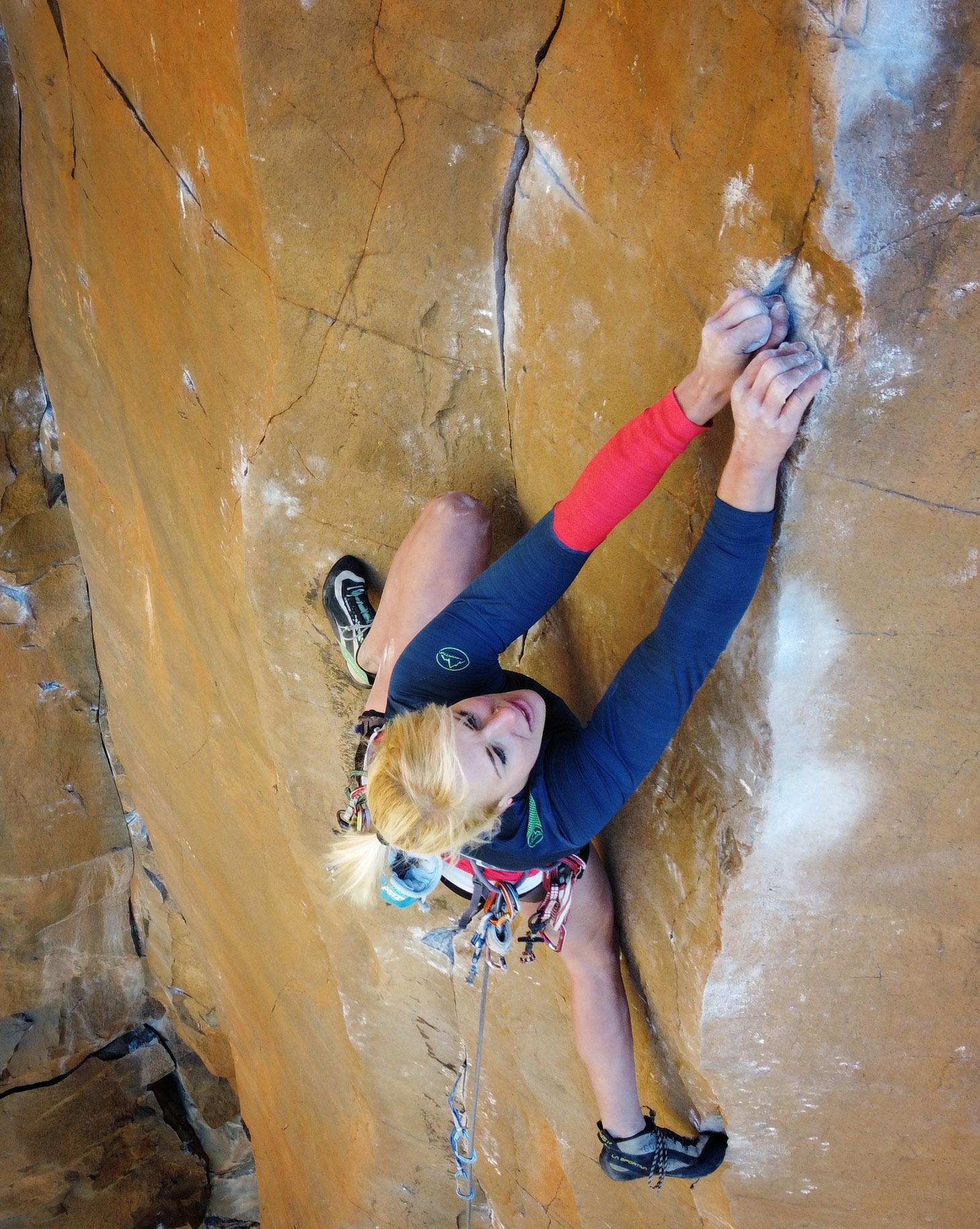 Lor Sabourin staring down the crux of East Coast Fist Bump (5.14a) at The Waterfall
