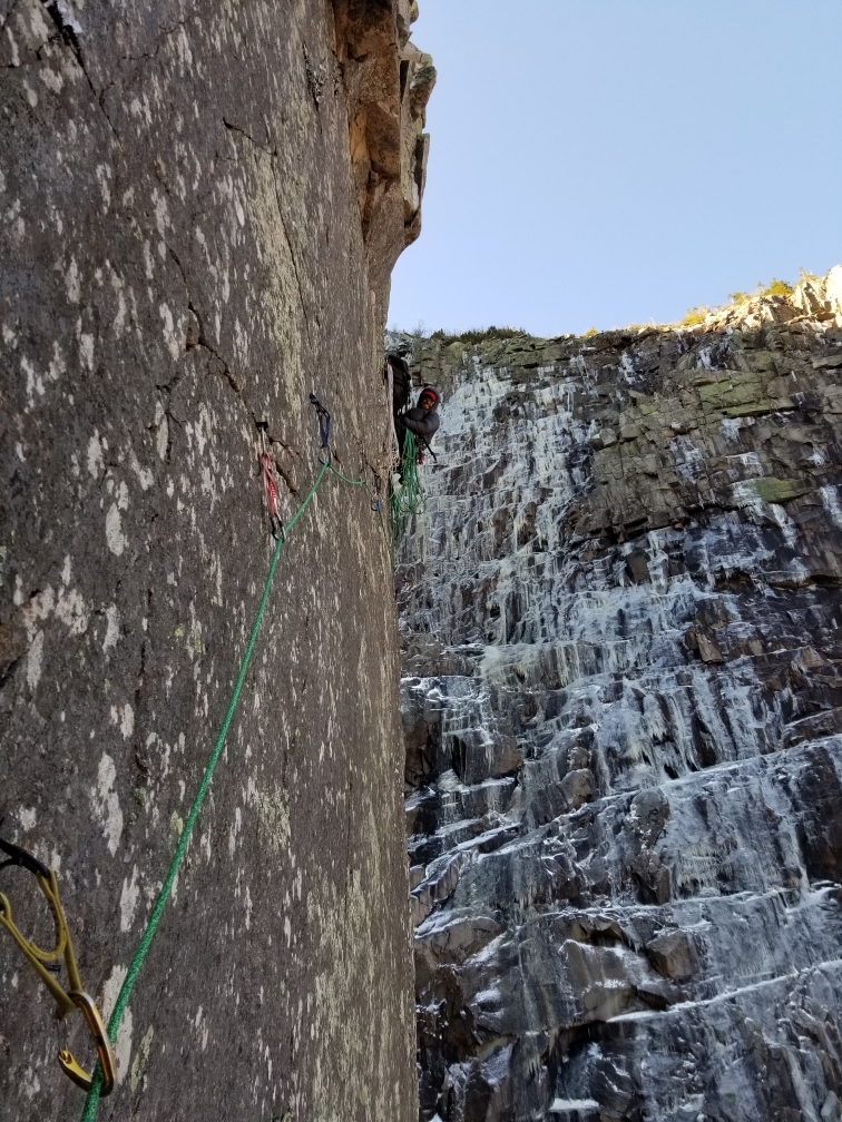 Nicolodi scopes out the technical M7 traverse of pitch one of Across the Great Divide from the pitch-one anchor. [Photo] Zac St. Jules