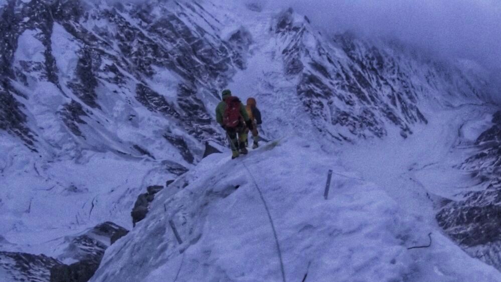 Descending fixed ropes on the Kinshofer Route. [Photo] Courtesy of Denis Urubko