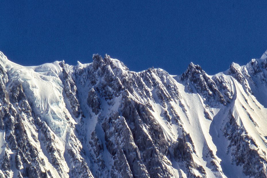 The Pugilist at Rest (5.10 A3 M5) follows the long center rib in the middle of the photo. The Wilford Couloir is the gully just to the left. [Photo] Mark Wilford