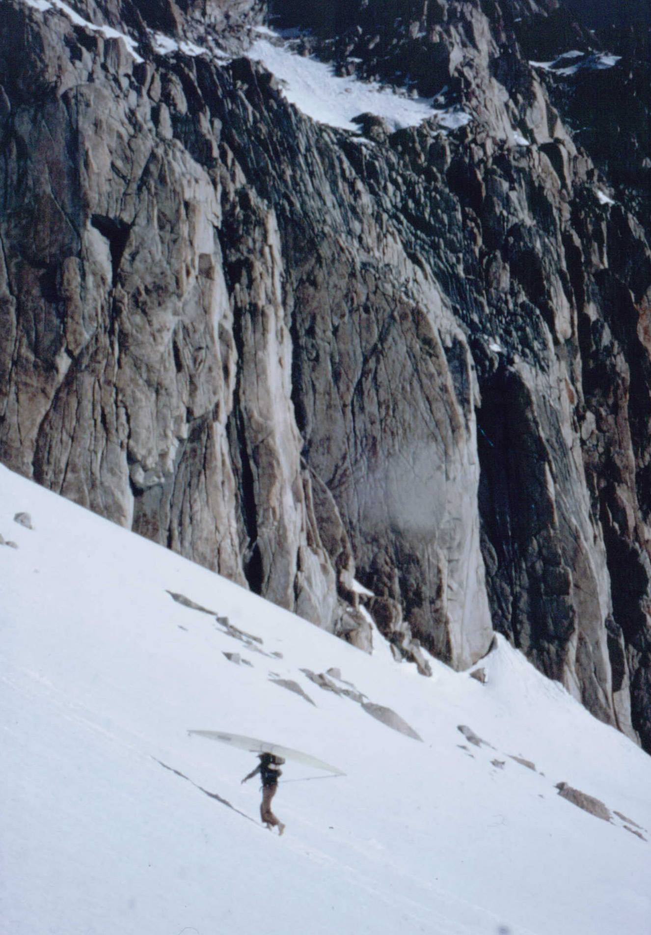 Robbins carries a kayak over Mt. Whitney for the first descent of the Kern River, June 1, 1981. [Photo] Reg Lake