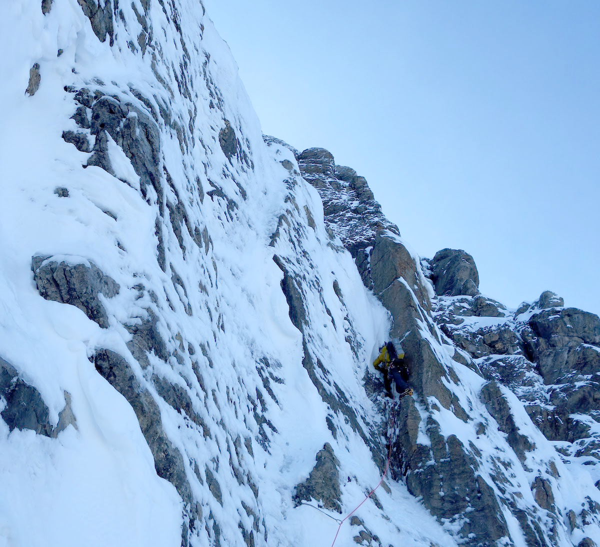 Hawthorn excavating a snow-choked dihedral near the Emperor Ridge. [Photo] Ethan Berman