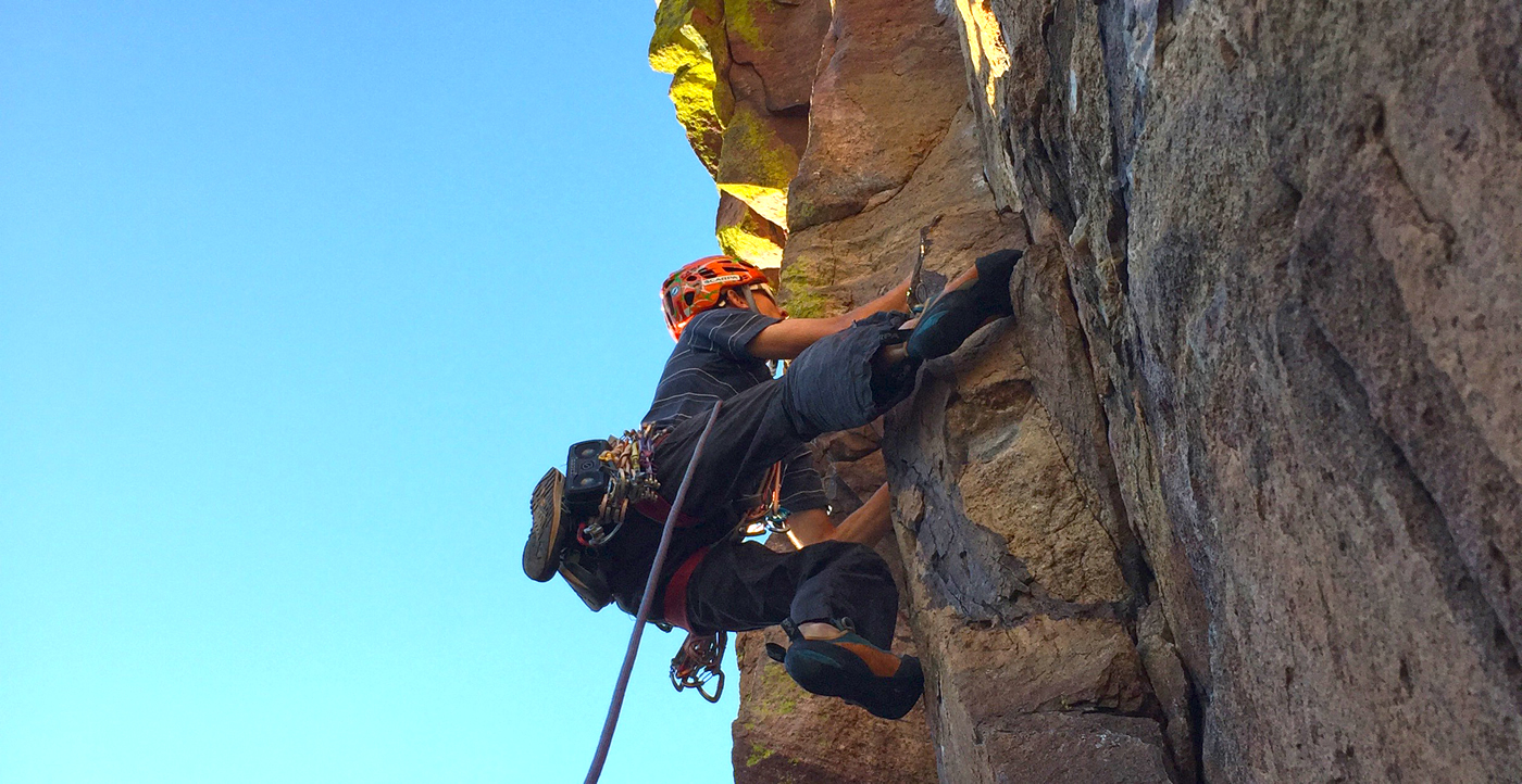 Scott Bennett approaching the crux on the Naked Edge (5.11b, 460').