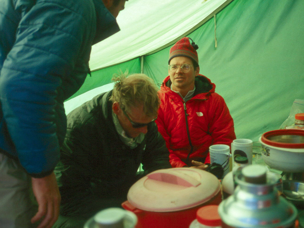 Kent Harvey (blue) examines Conrad Anker’s head wounds while Mark Holbrook looks on. [Photo] Andrew McLean