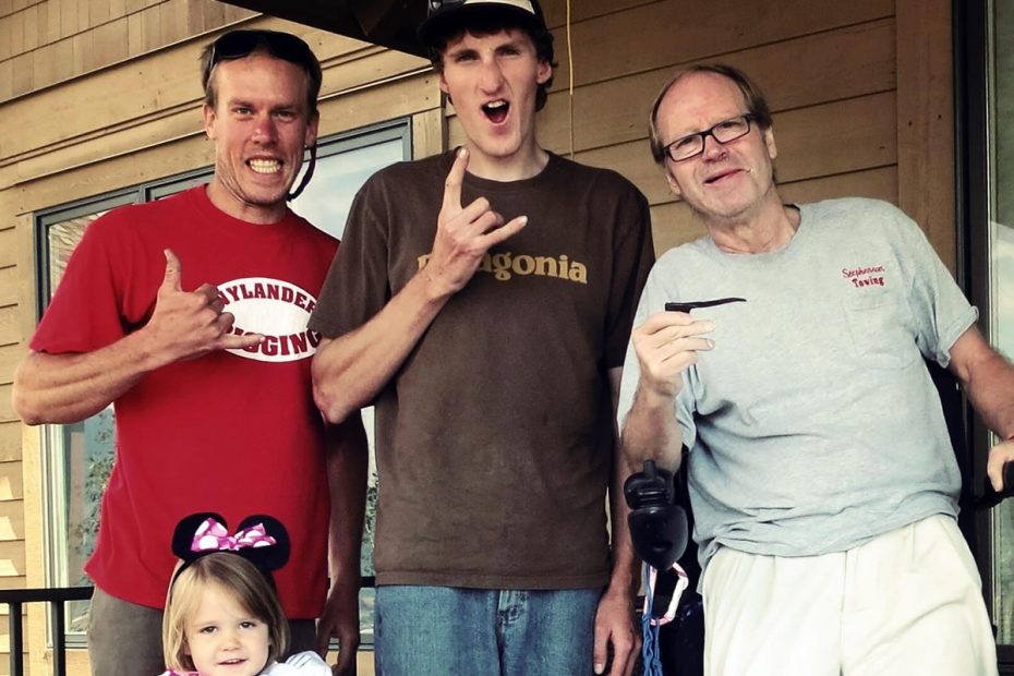 Kyle Dempster, Hayden Kennedy, Jeff Lowe and Lowe's granddaughter. In 2013 Dempster and Kennedy, along with the late Justin Griffin, established a variation to the North Tower Crack, which they called the Lowe-Spark (IV 5.13 A0, 1,200'). Here Lowe holds one of the pitons that he'd placed in 1969 and that the 2013 ascent team recovered from the original route. [Photo] Kyle Dempster.