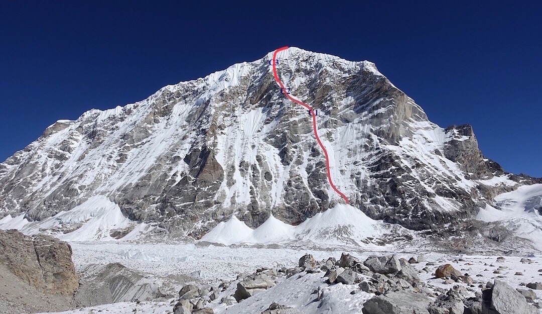 The west face of Tengi Ragi Tau (ca. 6940m) with Release the Kraken (AI5 M5+, 1600m) drawn in red. Alan Rousseau and Tino Villanueva's three bivy sites are marked in blue near the beginning, middle and top of the upper rockband. [Photo] Alan Rousseau