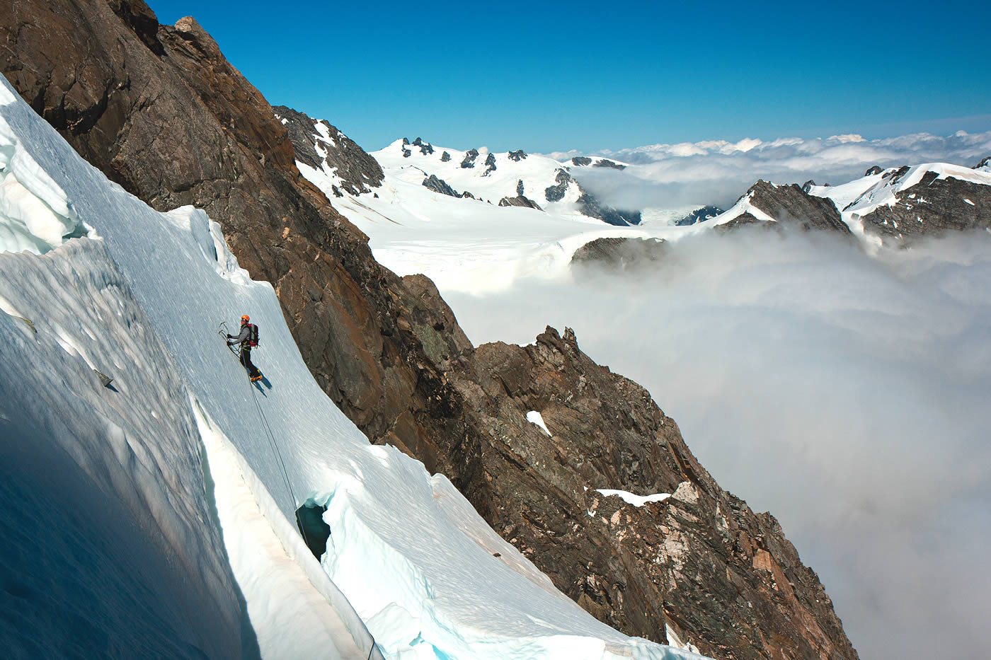 Vinton-Boot searching for a way through the steep and broken Stevenson Glacier en route to the West Rib of Mt. Walter. [Photo] Kester Brown
