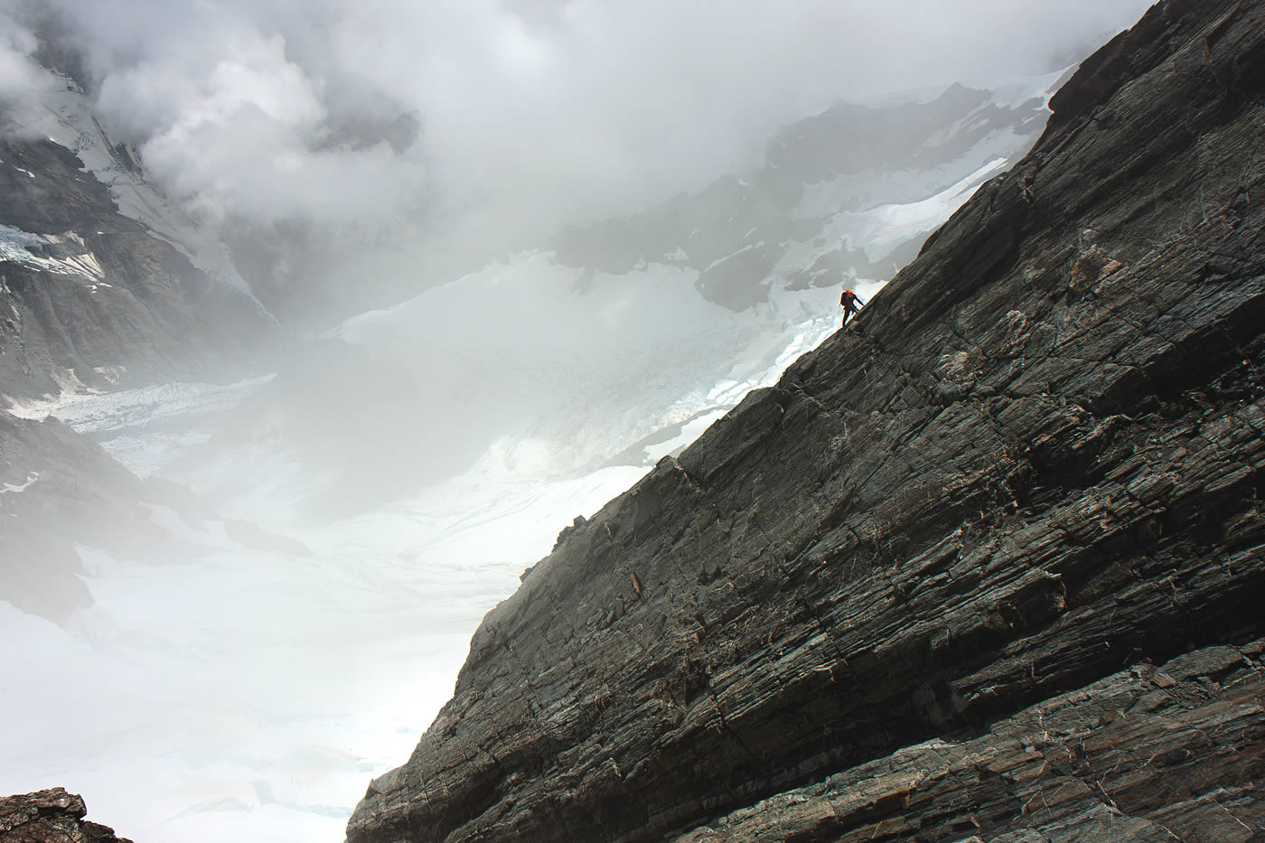 Vinton-Boot on the fourth pitch of Stuntman and Chronic, a buttress that juts from the West Rib. The philosopher Jack Turner has argued, Those who spend time on summits often disagree with those whose vision reflects more limited perspectives.... From this vantage point, one can also discern how the land has been affected by man (Teewinot). [Photo] Kester Brown