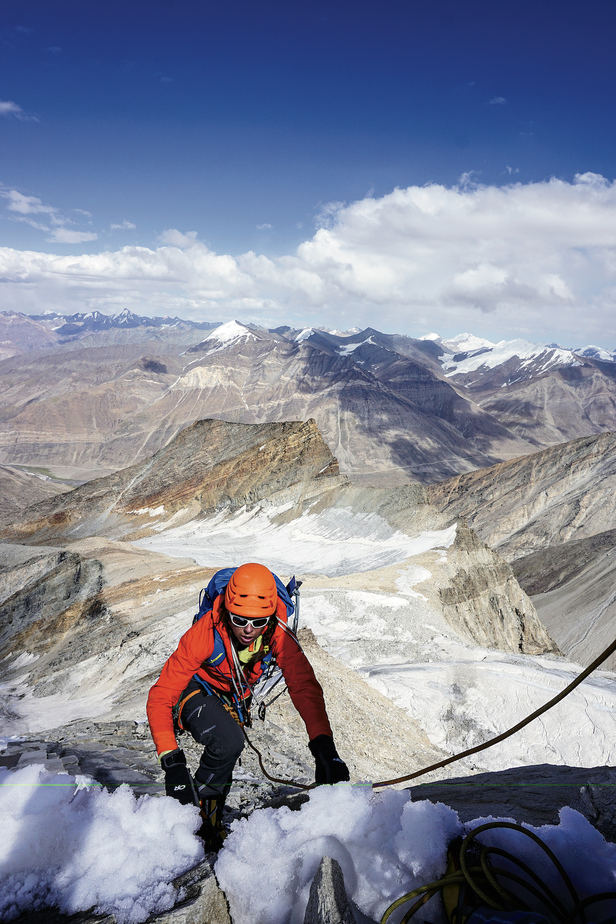 Rachel Spitzer below the summit ridge of Tare Parvat (5577m), Zanskar, India. Spitzer, Lisa Van Sciver and Pfaff named their route Unattached (5.6 WI3 AI4 M4, 600m, 2015). In the 2009 Himalayan Journal, Indian explorer Harish Kapadia described how each bend in the road in Zanskar reveals another unclimbed face. Sip wine at one valley, climb and move on to the next one to open another bottle, he recommended. [Photo] Anna Pfaff