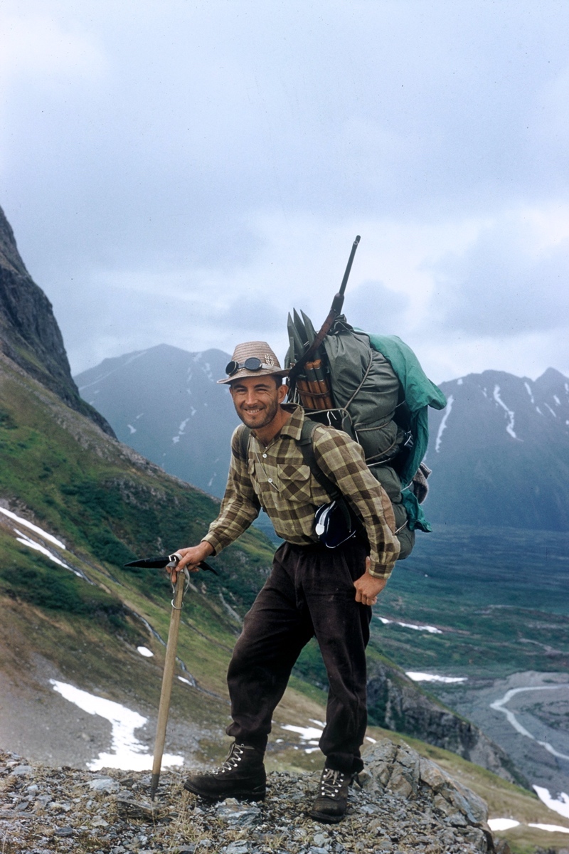 Wayne Merry happily managing an 80-pound pack in support of Alaskan glacier survey and mapping work for the International Geophysical Year (IGY) in 1958. [Photo] Dick Long (Wayne Merry collection)