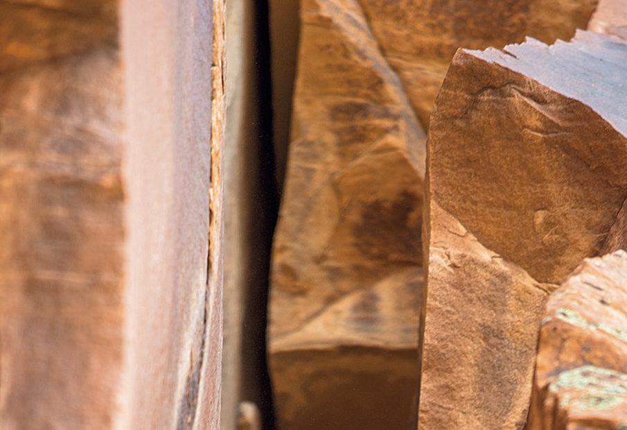 Zach Harrison on the first free ascent of the Southeast Face (III 5.11+ R, 520') of Zoroaster Temple, Grand Canyon National Park, Arizona. [Photo] Blake McCord