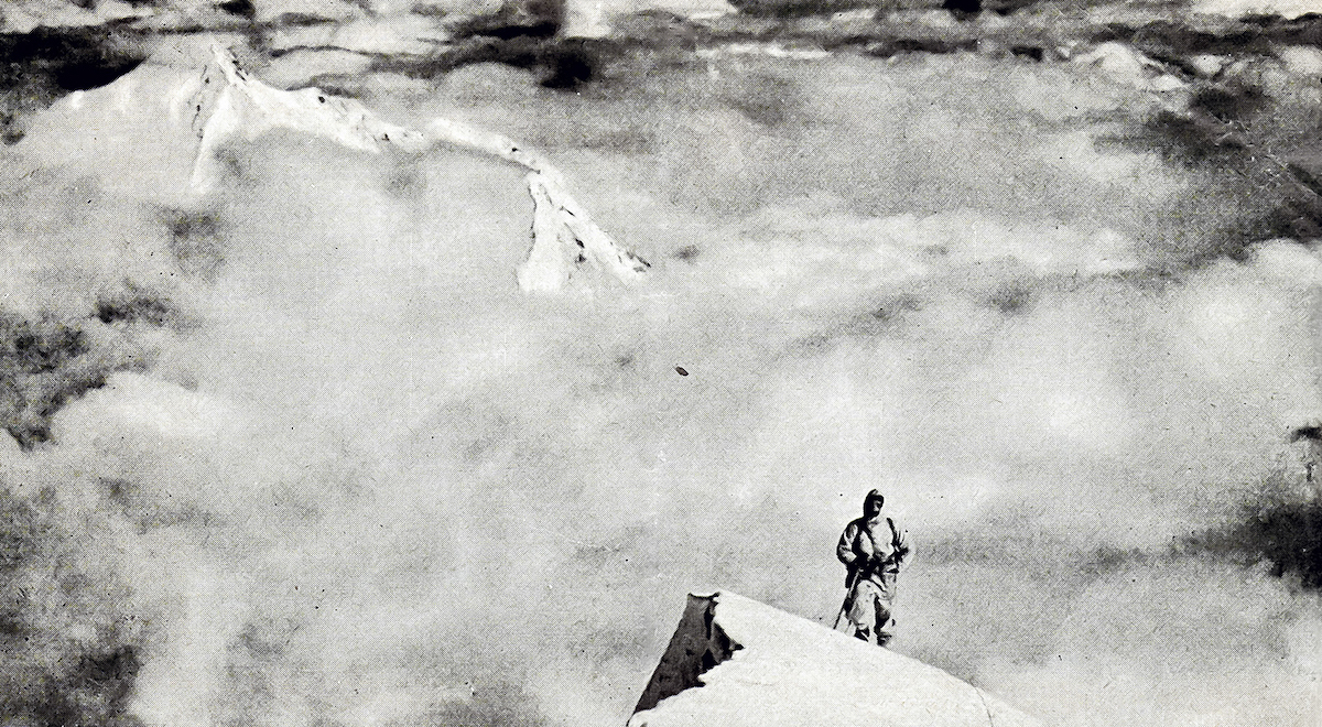 Janusz Klarner arrives on the summit snowfield of Nanda Devi East in 1939. Nanda Kot is visible in the background. [Photo] Jakub Bujak collection