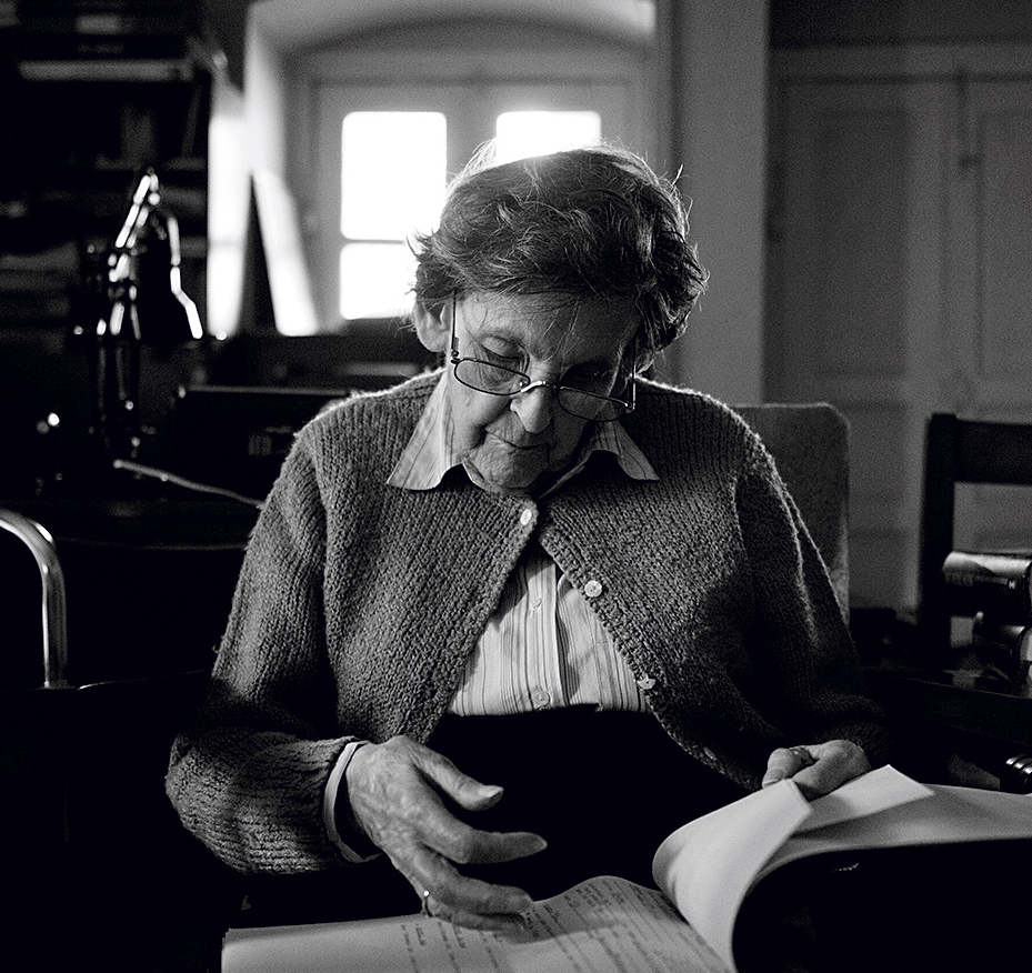 The great Himalayan chronicler Elizabeth Hawley paging through files at her apartment in Dilli Bazar, Nepal, after the 2015 earthquake. [Photo] Alet Pretorius