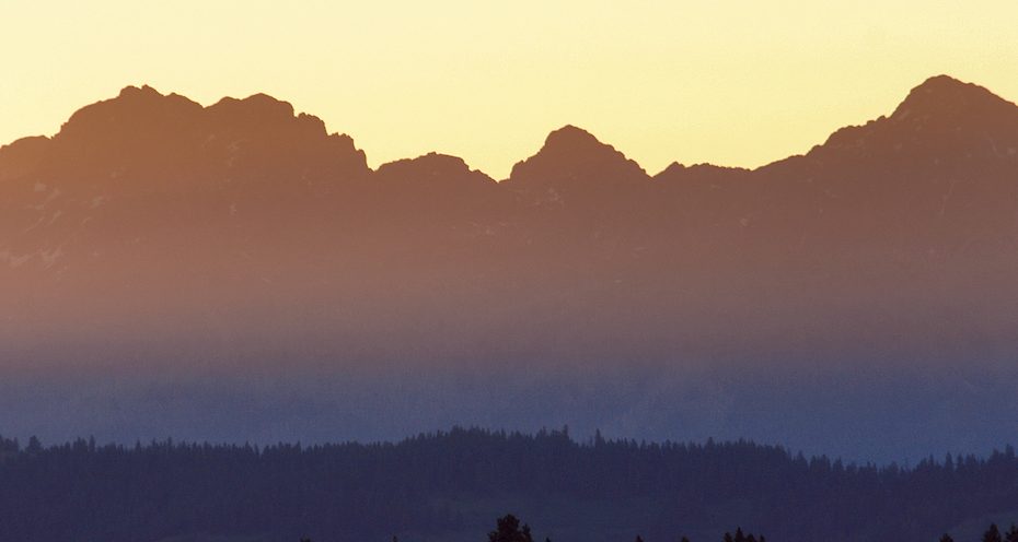 Sunrise over Hells Canyon and Idaho's Seven Devils Mountains as seen from the Wal'wa.maXs (Wallowa Mountains) of Oregon. [Photo] Joe Whittle