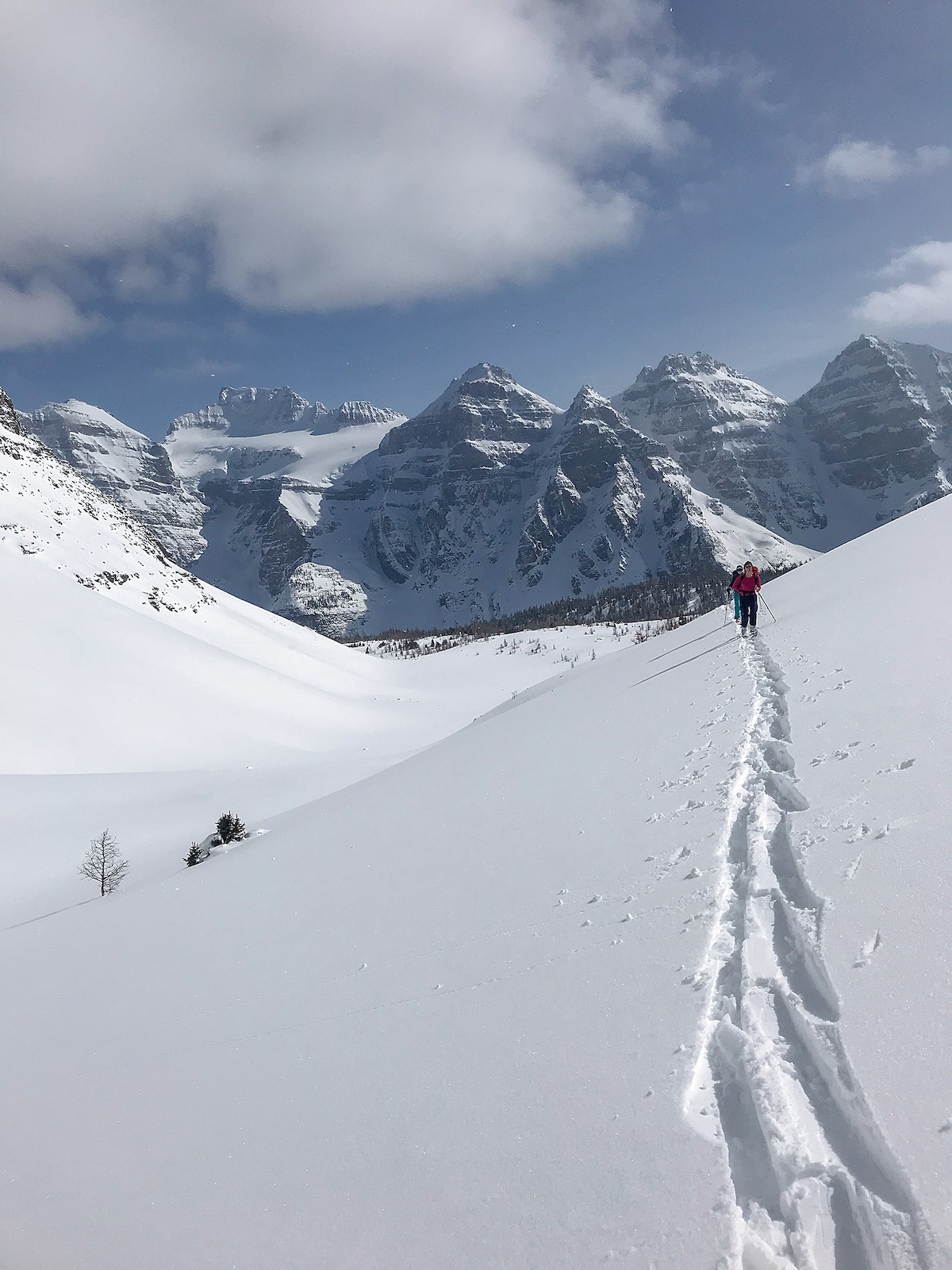 Forty-five minutes before a size 2.5 avalanche struck Sentinel Pass, Kadatz and Maia Schumacher skin in front of Mt. Fay and the Valley of the Ten Peaks. [Photo] Tim Banfield