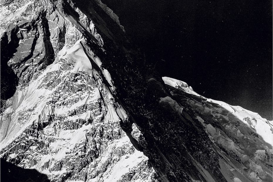 The north buttress of Mt. Kennedy as seen during the 1935 National Geographic Society Yukon Expedition. At the time, Bob Bates wrote that he hoped the peak would be called Mt. Washburn. It was known as East Hubbard until it was renamed for President Kennedy in 1965. In his years as director of the Boston Museum of Science, Washburn hung an enlarged version of this photograph on his office wall. [Photo] Bradford Washburn, Bradford Washburn collection, Museum of Science