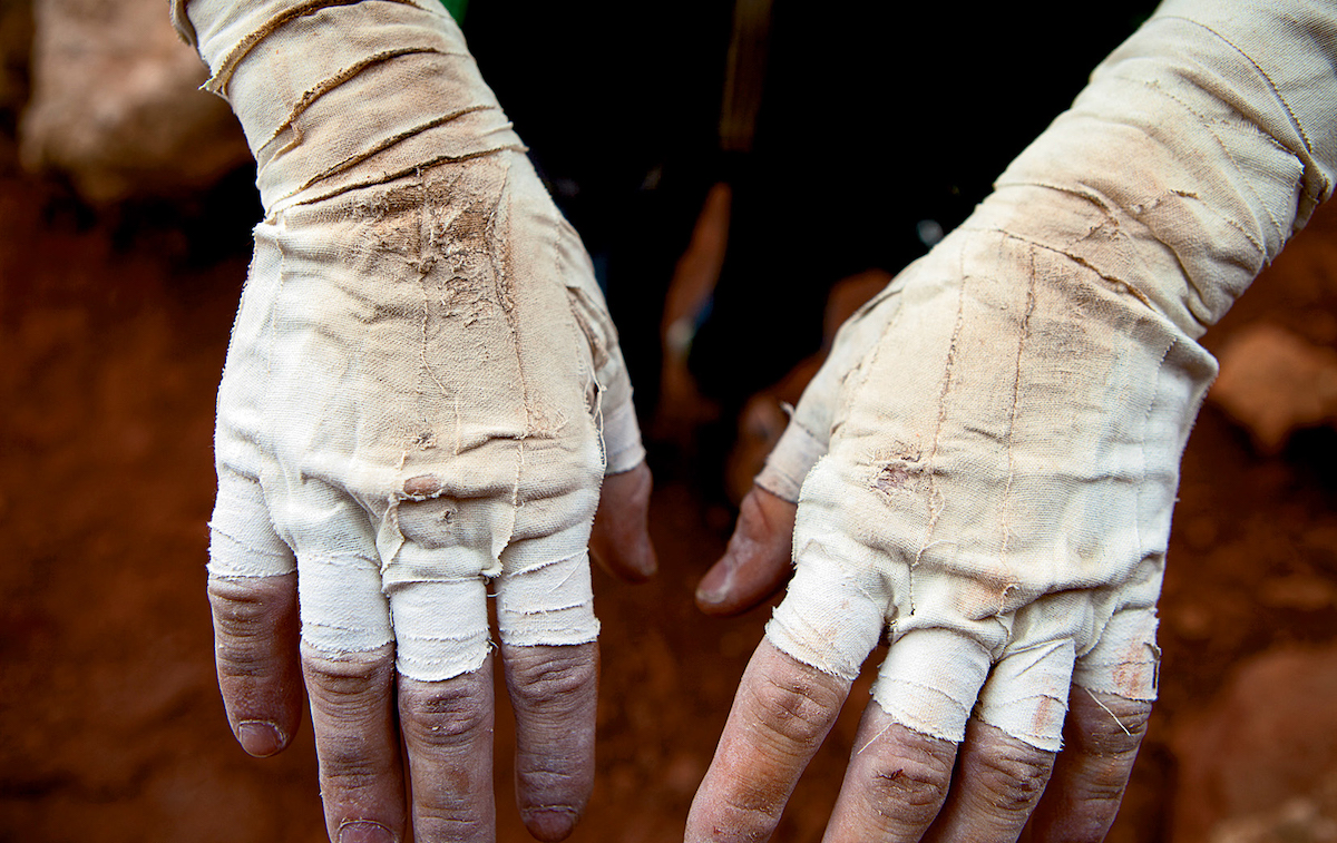 A climber displays their worn tape gloves. [Photo] Andrew Burr