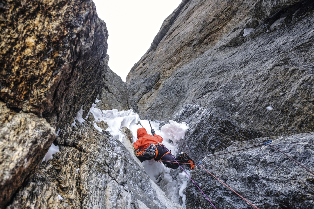 Starting the second pitch on the second day of All or Nothing. Prezelj spent much time cleaning snow to find placements for tools and protection. The mixed climbing game was as enjoyable as it can get on such terrain. [Photo] Urban Novak